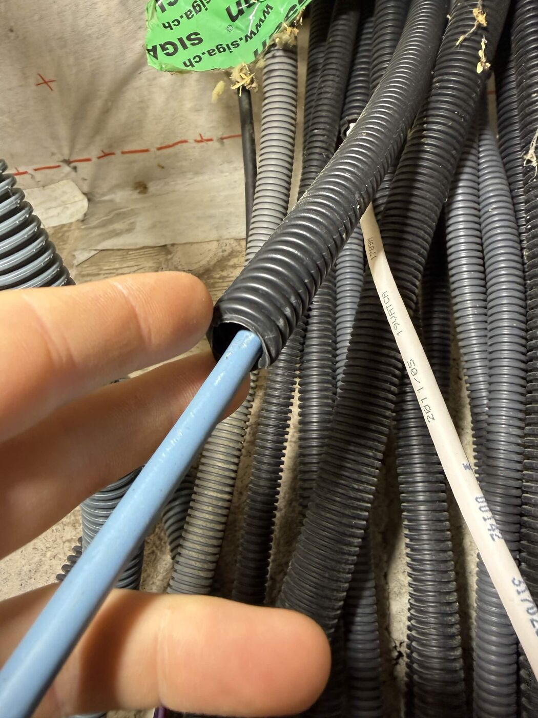 Replacing an antenna conduit with a Category 6 internet cable, among a bundle of technical conduits
